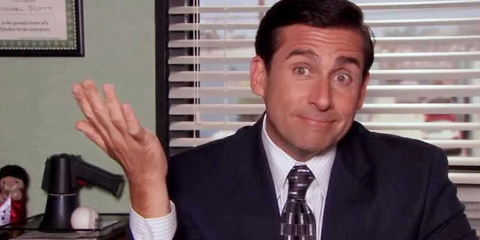 Steve Carell Michael Scott shrugging toward the camera in The Office 