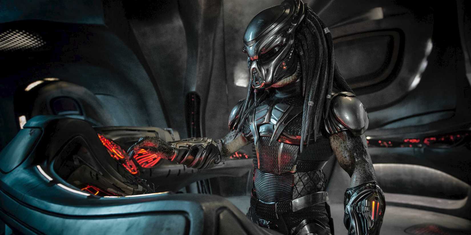 The Predator at a ship console, from The Predator (2018).