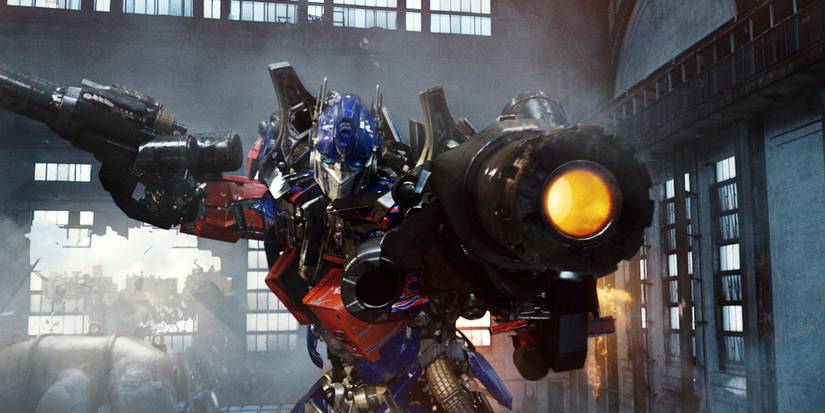 Optimus Prime aiming his blaster at someone off-camera in Transformers: Revenge of the Fallen