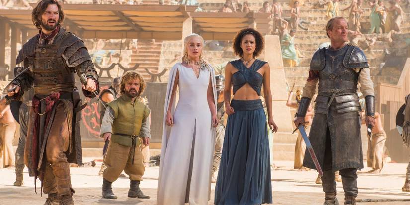 Daenerys Targaryen (Emilia Clarke) and her closest advisors stand surrounded in the fighting pits as the Sons of the Harpy launch an ambush.
