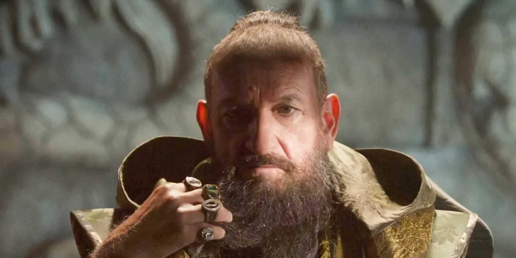 The Mandarin strokes his beard in Iron Man 3.