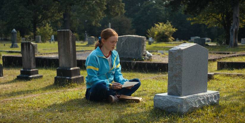 Max sitting in front of Billy's grave in Stanger Things Chapter Four Dear Billy.