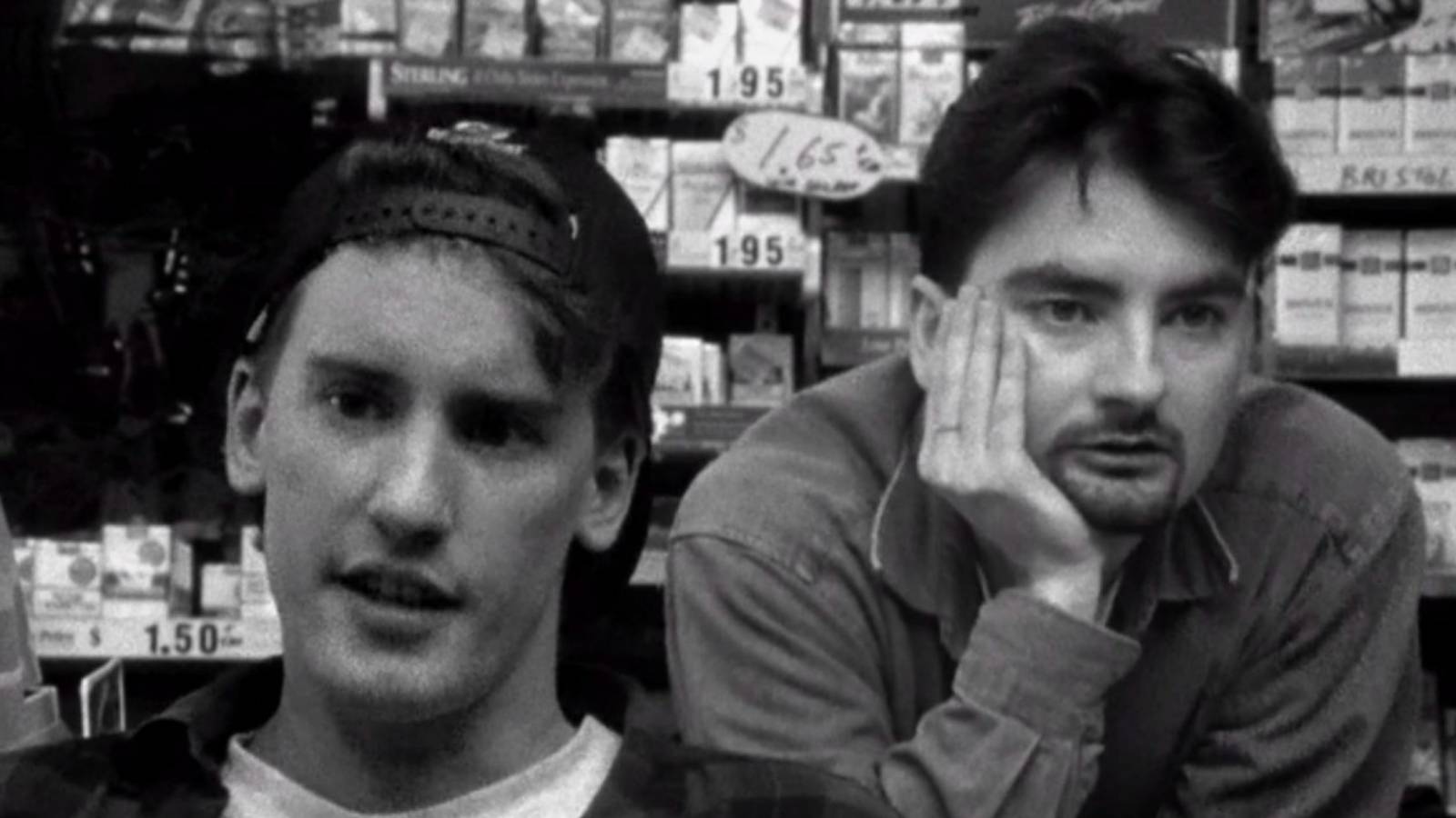 A still from Clerks - two workers looking bored inside a convenience store