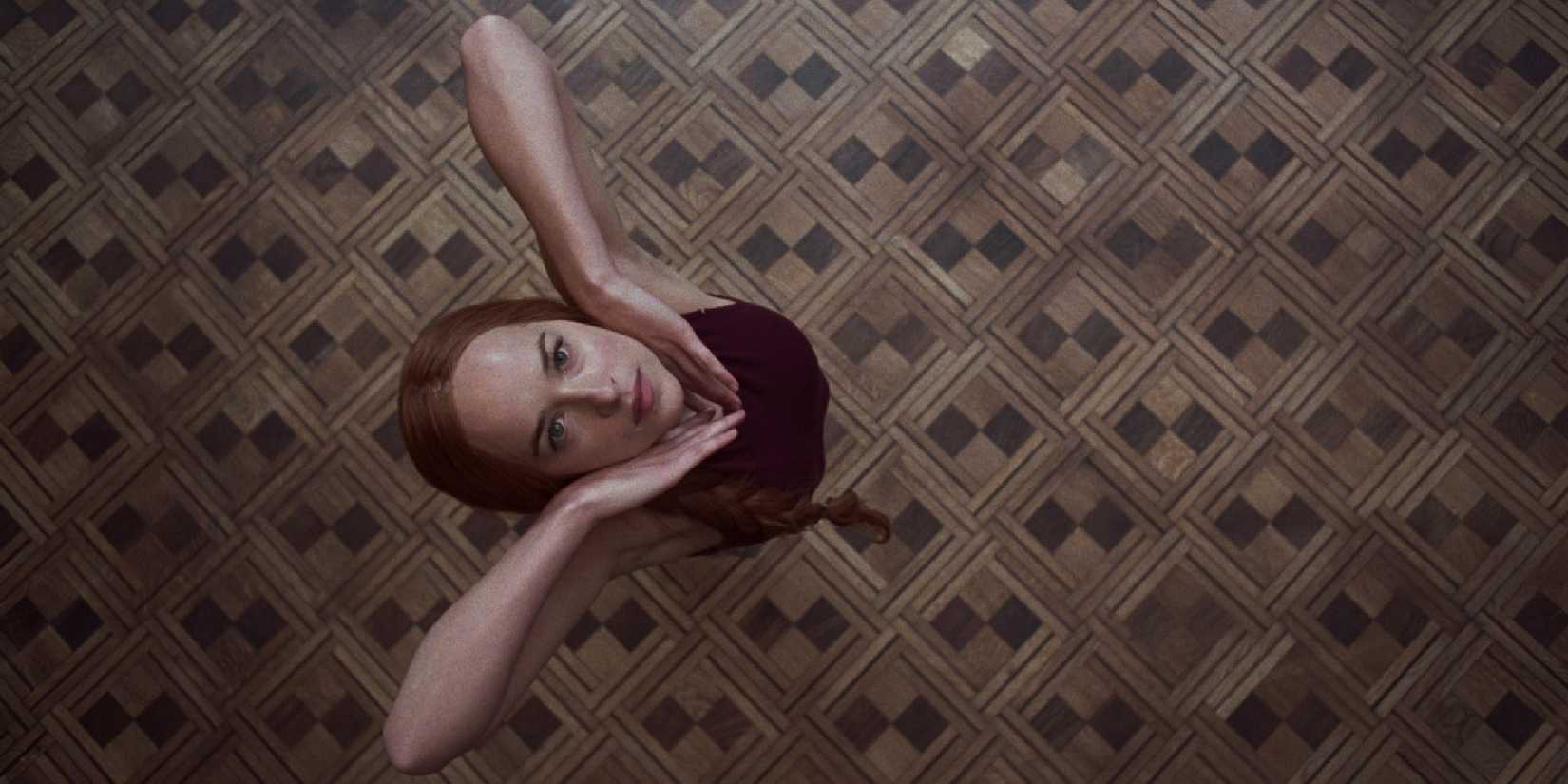 Dakota Johnson in Suspiria looking up.