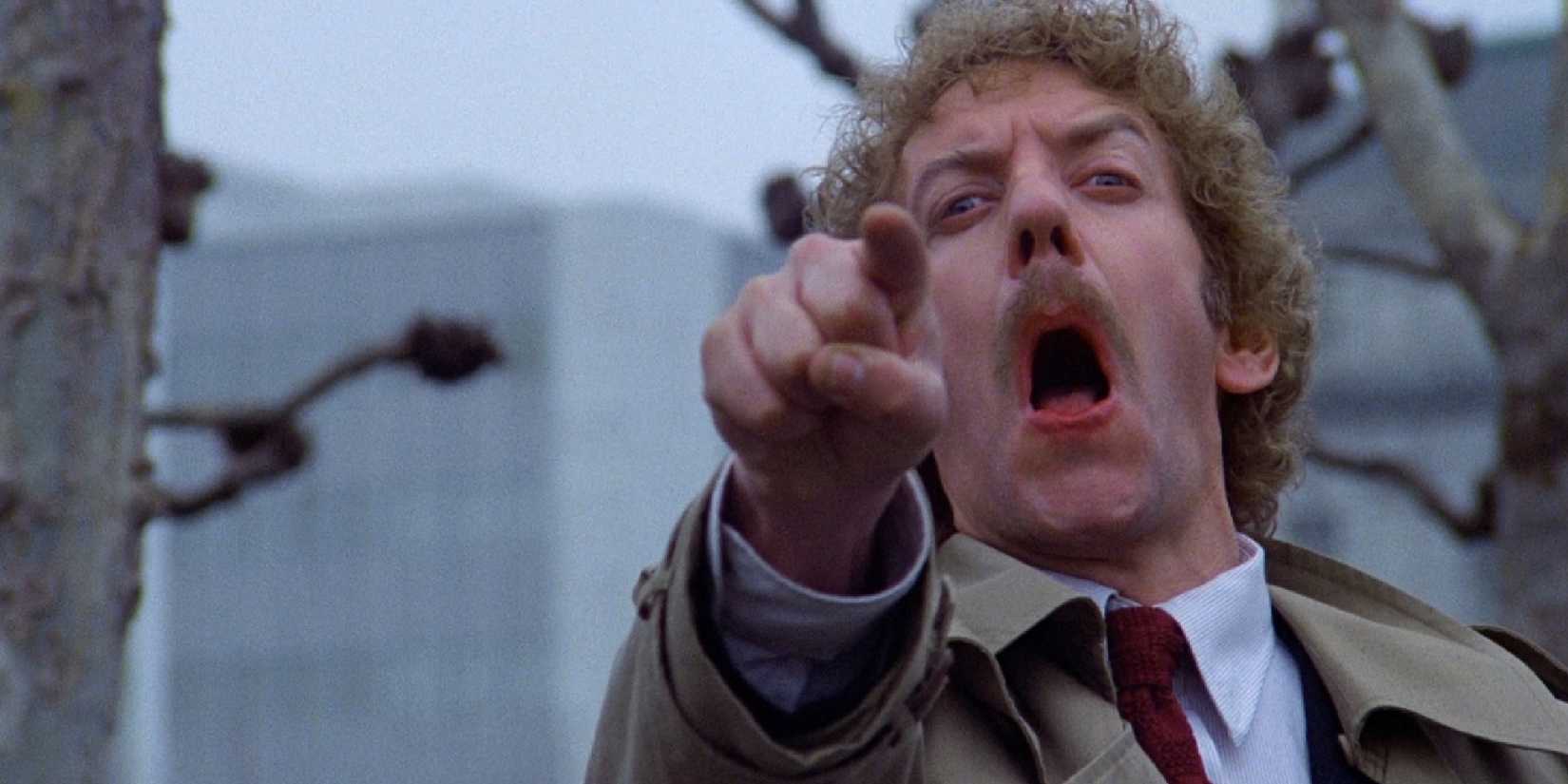 Donald Sutherland as Matthew Bennell screaming, pointing at the camera in Invasion Of The Body Snatchers.