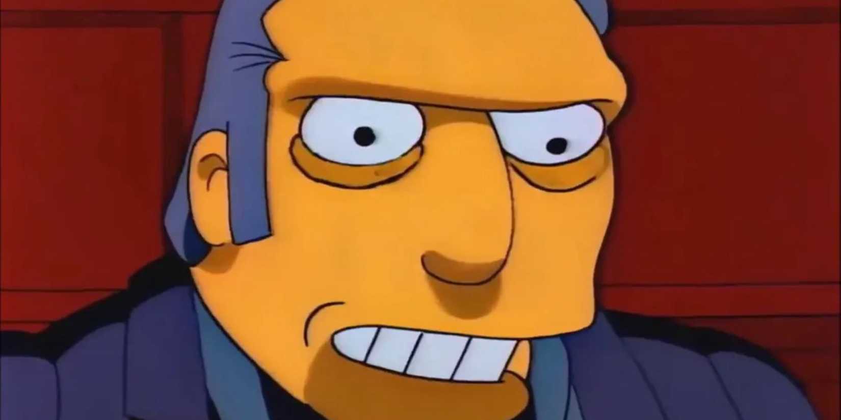 A closeup of Fat Tony smiling menacingly in The Simpsons.