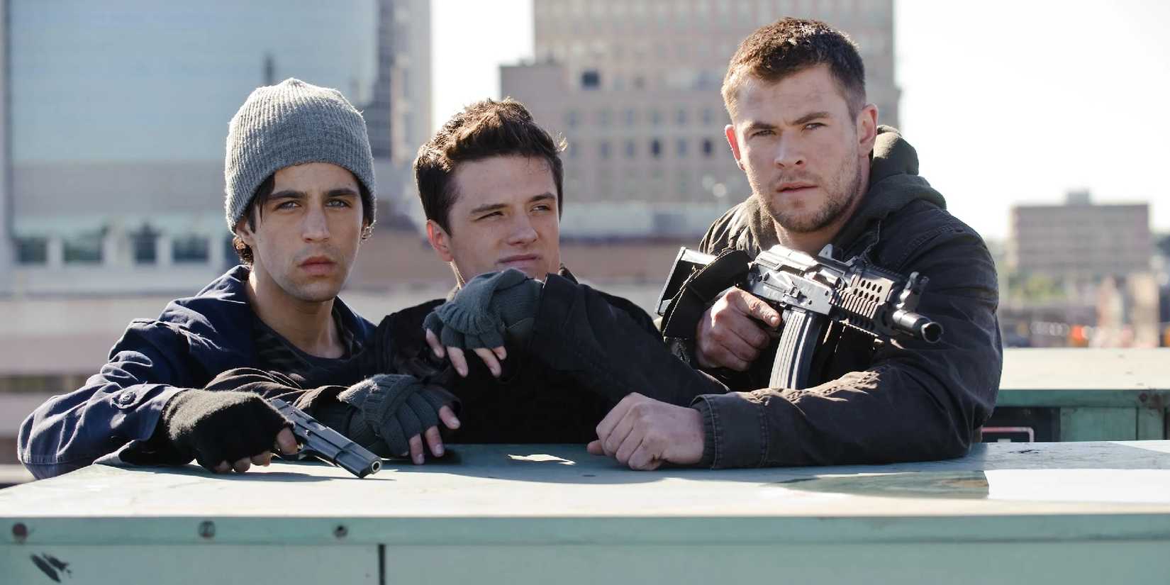 Josh Hutcherson, Chris Hemsworth, and Josh Peck looking ahead in Red Dawn