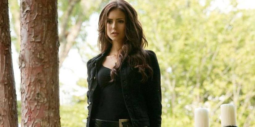 Nina Dobrev (Katherine Pierce) outside looking at something off-camera in The Vampire Diaries.