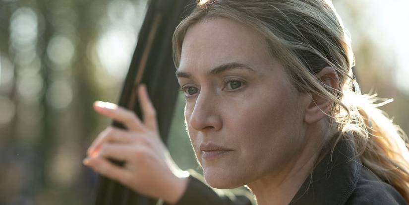 Kate Winslet as Mare looking off camera in Mare of Easttown