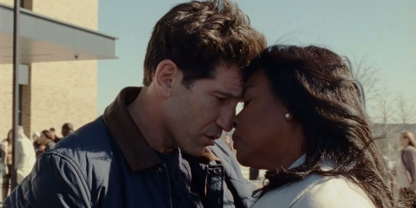 Jon Bernthal as Brett Hamilton and Aunjanue Ellis-Taylor as Isabel Wilkerson embracing in Origin.