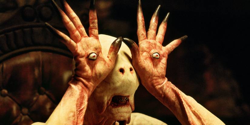 The Pale Man showing off the eyeballs on the palms of his hands in 'Pan's Labyrinth'.