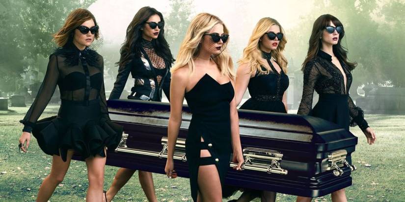 The Liars wearing stylish black dresses and sunglasses, carrying a casket in a promo image for Pretty Little Liars