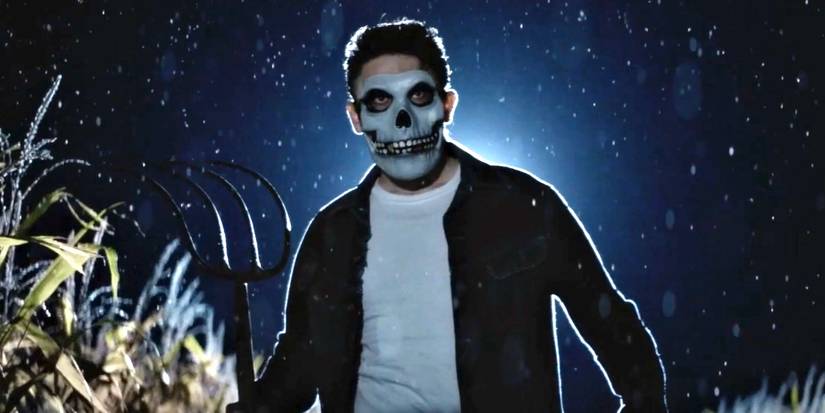 A character wears a skull face mask in 'Dark Harvest'