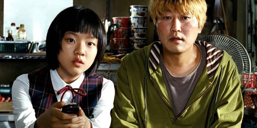 Song Kang-ho and Ko Asung in 'The Host' staring with fear