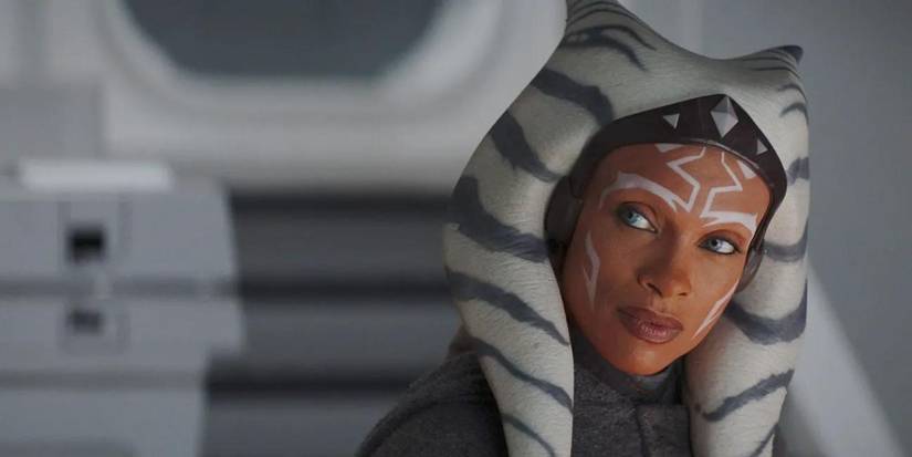 Star Wars character Ahsoka, played by actress Rosario Dawson, stands in a spaceship in Ahsoka series.