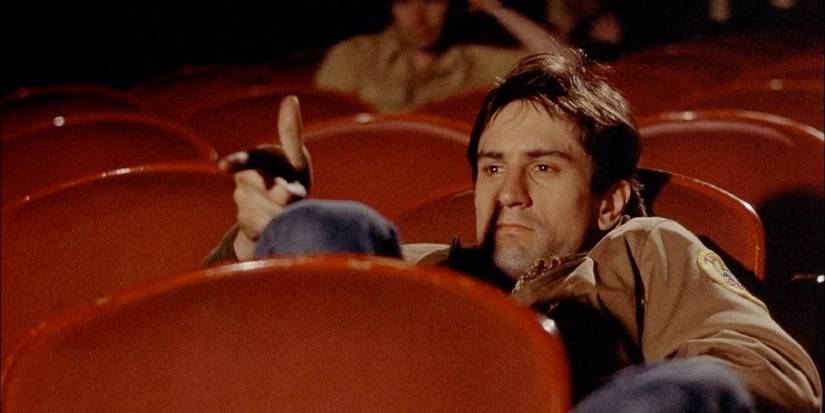 Travis Bickle st the movie theater in Taxi Driver