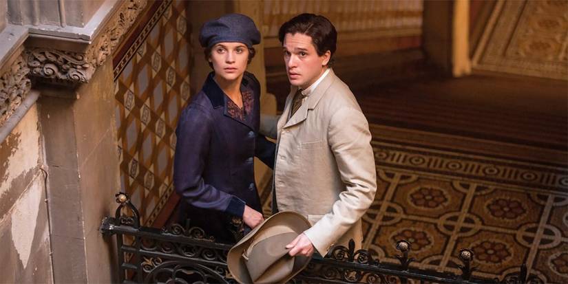 Alicia Vikander as Vera and Kit Harington as Roland looking up at a person offscreen in Testament of Youth