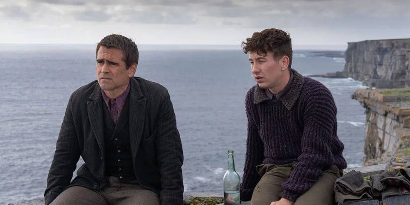 Colin Farrell and Barry Keoghan as Pádraic and Dominic looking to the distance in The Banshees of Inisherin