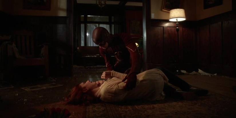 The Flash holding his mother