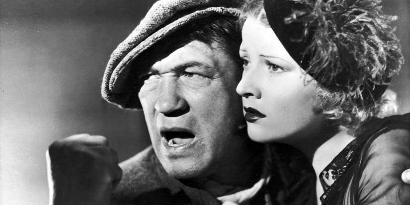 A man and a woman cheek-to-cheek looking ahead in The Informer - 1935