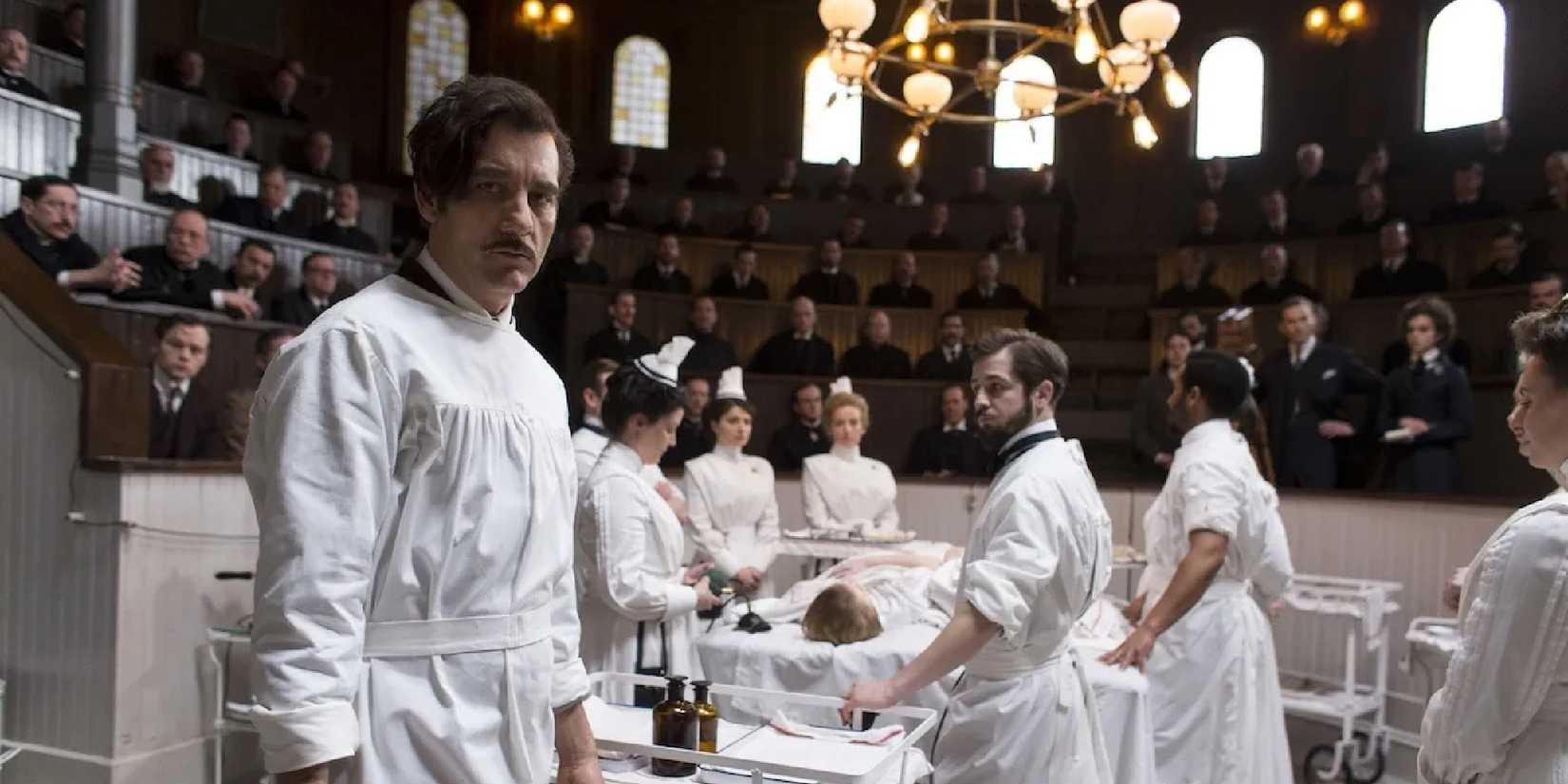 A group of doctors and nurses are about to perform surgery in a vintage operating theater in The Knick.