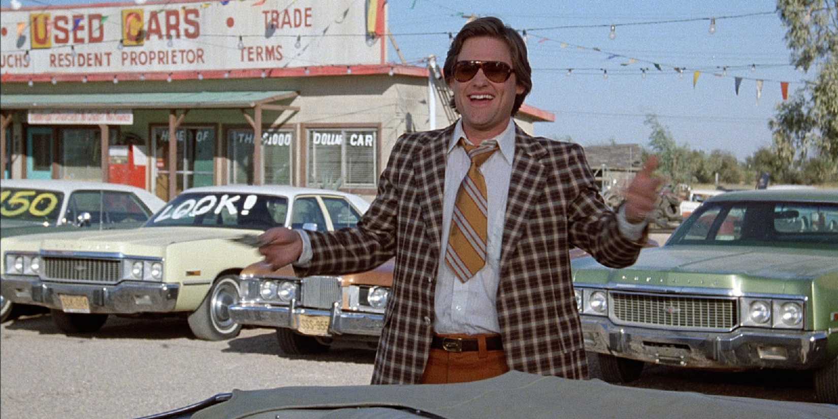 Kurt Russell as a car dealer in 'Used Cars'