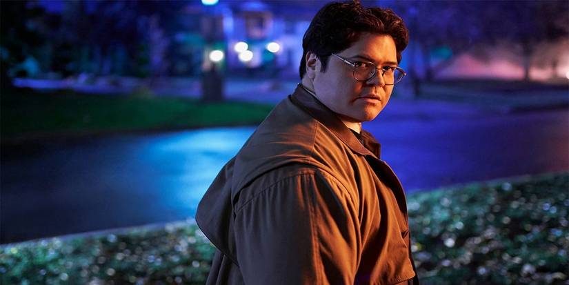 Guillermo (Harvey Guillén) standing in the dark looking back at the camera in What We Do in the Shadows Season 2, Episode 4, "The Curse"