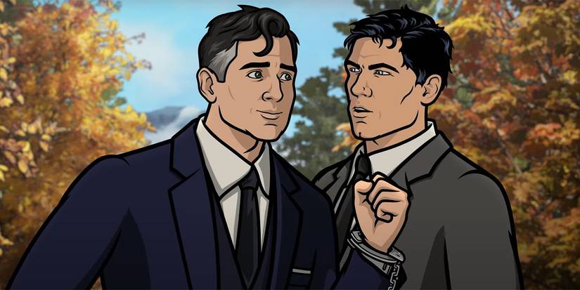 Two men in suits speak to each other and one is handcuffed in the animated series Archer.