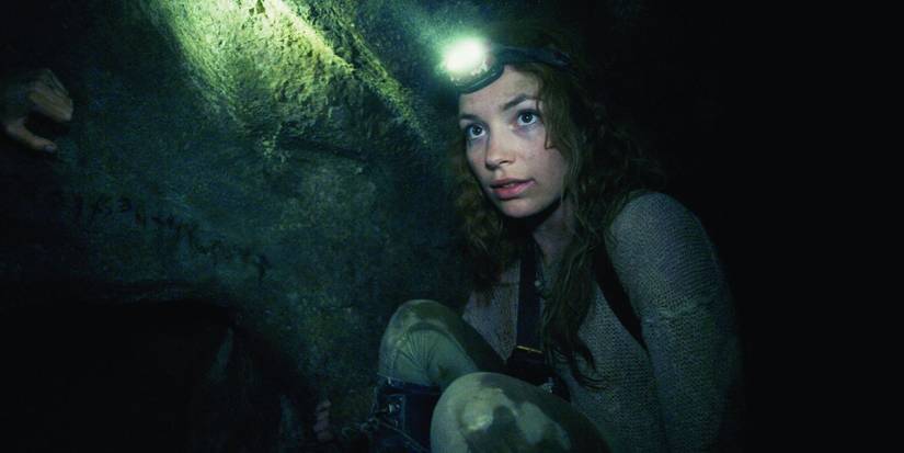Perdita Weeks walks in a tunnel in As Above, So Below.