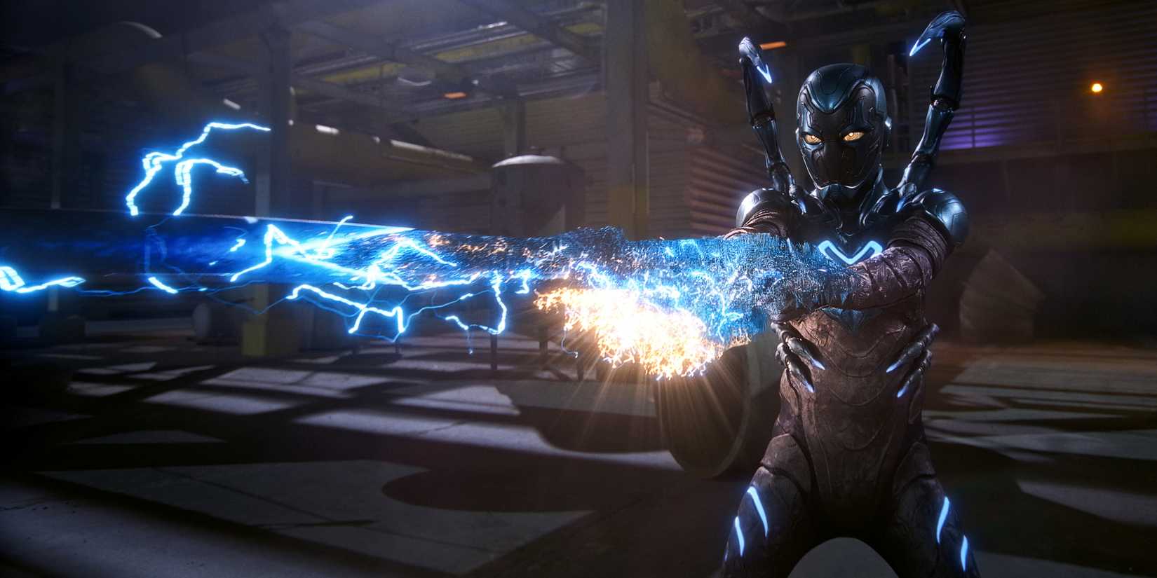 Xolo Maridueña as Blue Beetle shooting from his cannons in Blue Beetle