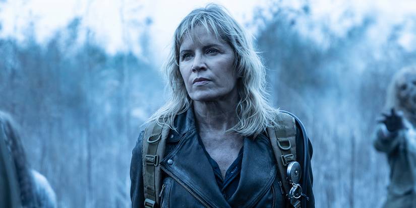 Madison on a grey background with a backpack looking disheveled in Fear the Walking Dead