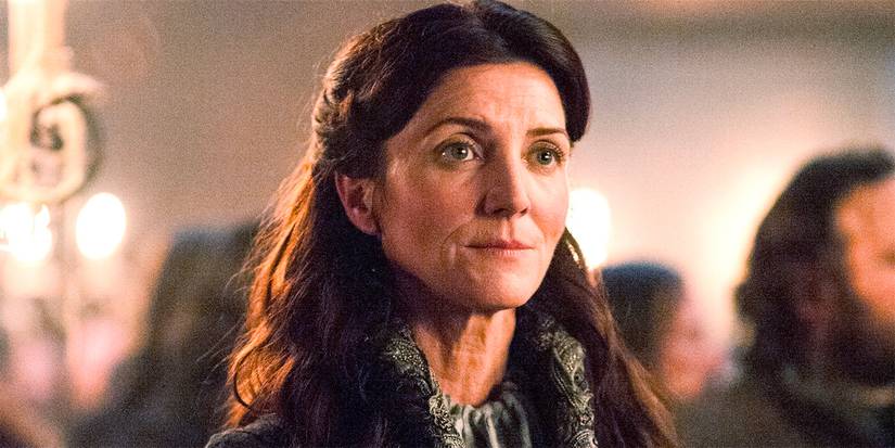 Michelle Fairley as Catelyn Stark looking intently ahead in Game of Thrones.