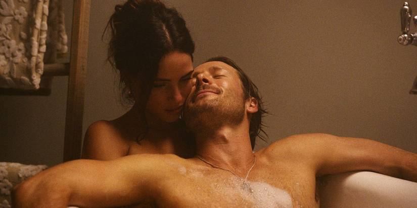 Glen Powell and Adria Arjona taking a bath in Hit Man