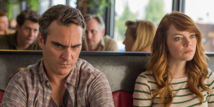 Joaquin Phoenix and Emma Stone as Abe and Jill riding the bus in Irrational Man