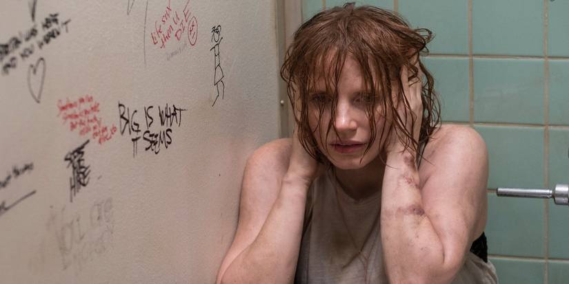 Jessica Chastain holding her head in a bathroom stall from IT Chapter 2