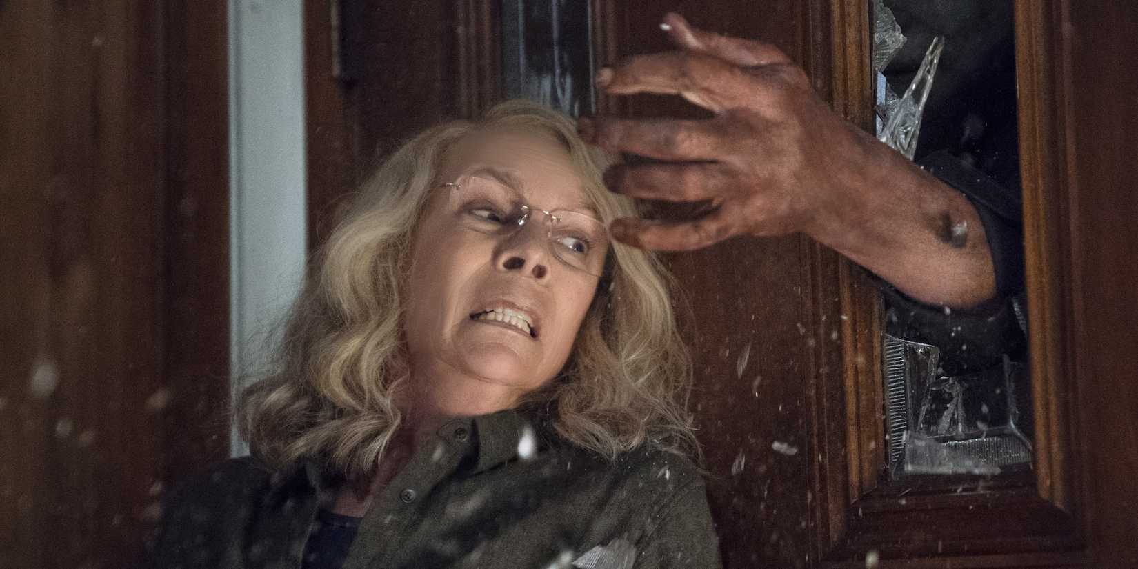 Jamie Lee Curtis as Laurie Strode being attacked by Michael Meyers in 'Halloween' (2018).