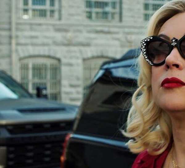 Jennifer Tilly as Tiffany Valentine wearing sunglasses and getting out of a car in Chucky Season 3
