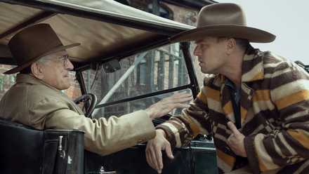 Leonardo DiCaprio as Ernest Burkhart and Robert De Niro as William Hale in Killers of the Flower Moon