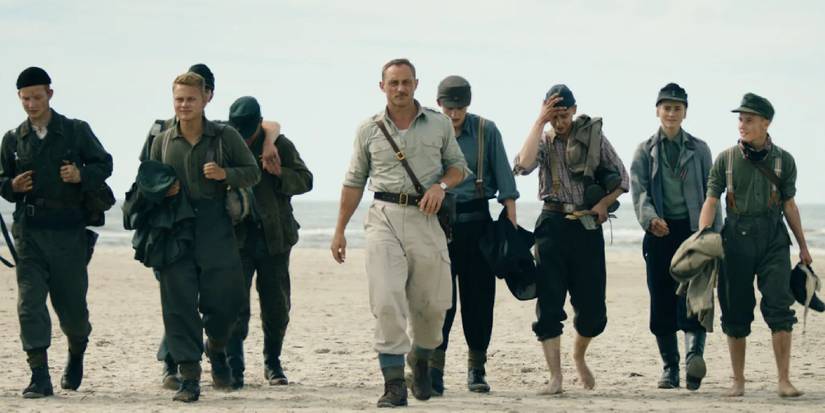 Land of Mine - 2015: Roland Møller in a scene with cast members