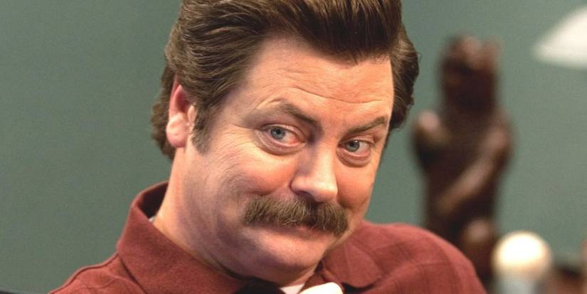 Actor Nick Offerman playing Ron Swanson smiling in Parks and Recreation