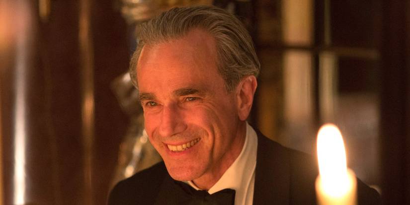 Reynolds Woodcock smiling at the dinner table in Phantom Thread