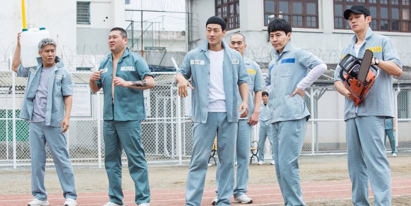 A group of prisoners in a yard in 'Prisoner Playbook'