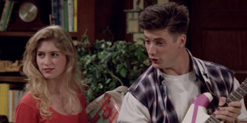 Dana looks annoyed while Cody holds a guitar on Step by Step