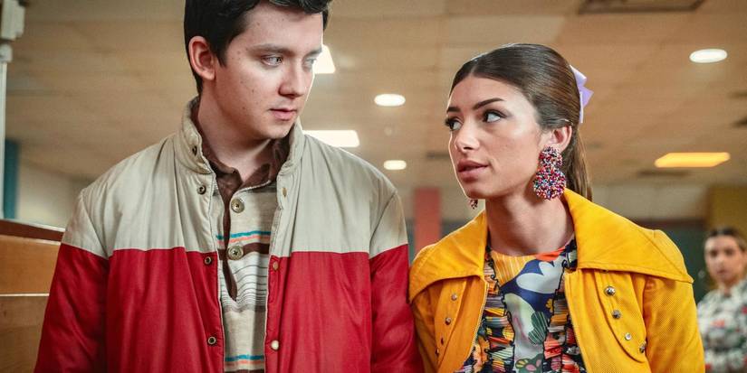 Asa Butterfield as Otis and Mimi Keene as Ruby walk together in Sex Education