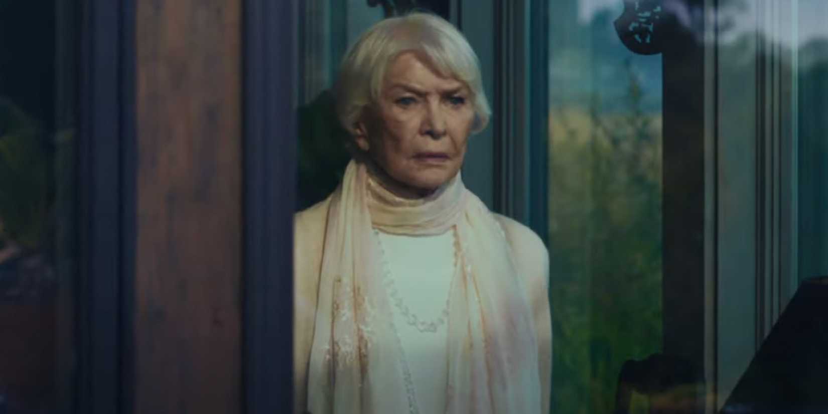 Chris MacNeil (Ellen Burstyn) frowns and looks out the window in 'The Exorcist: Believer'