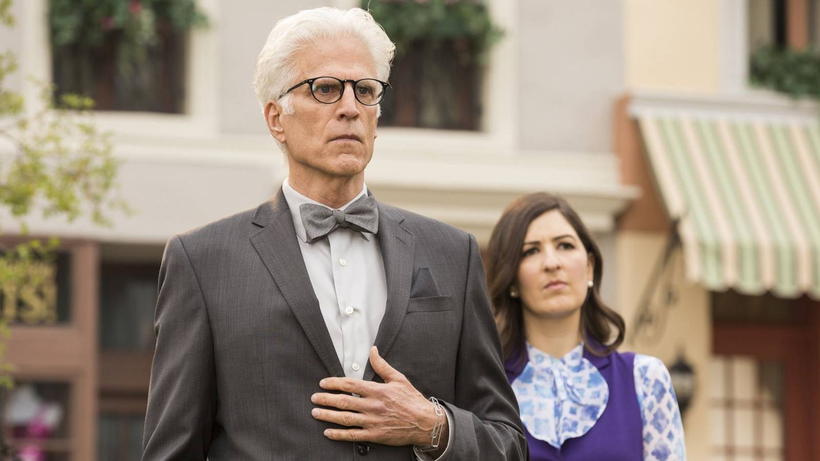 Michael and Janet from The Good Place standing together