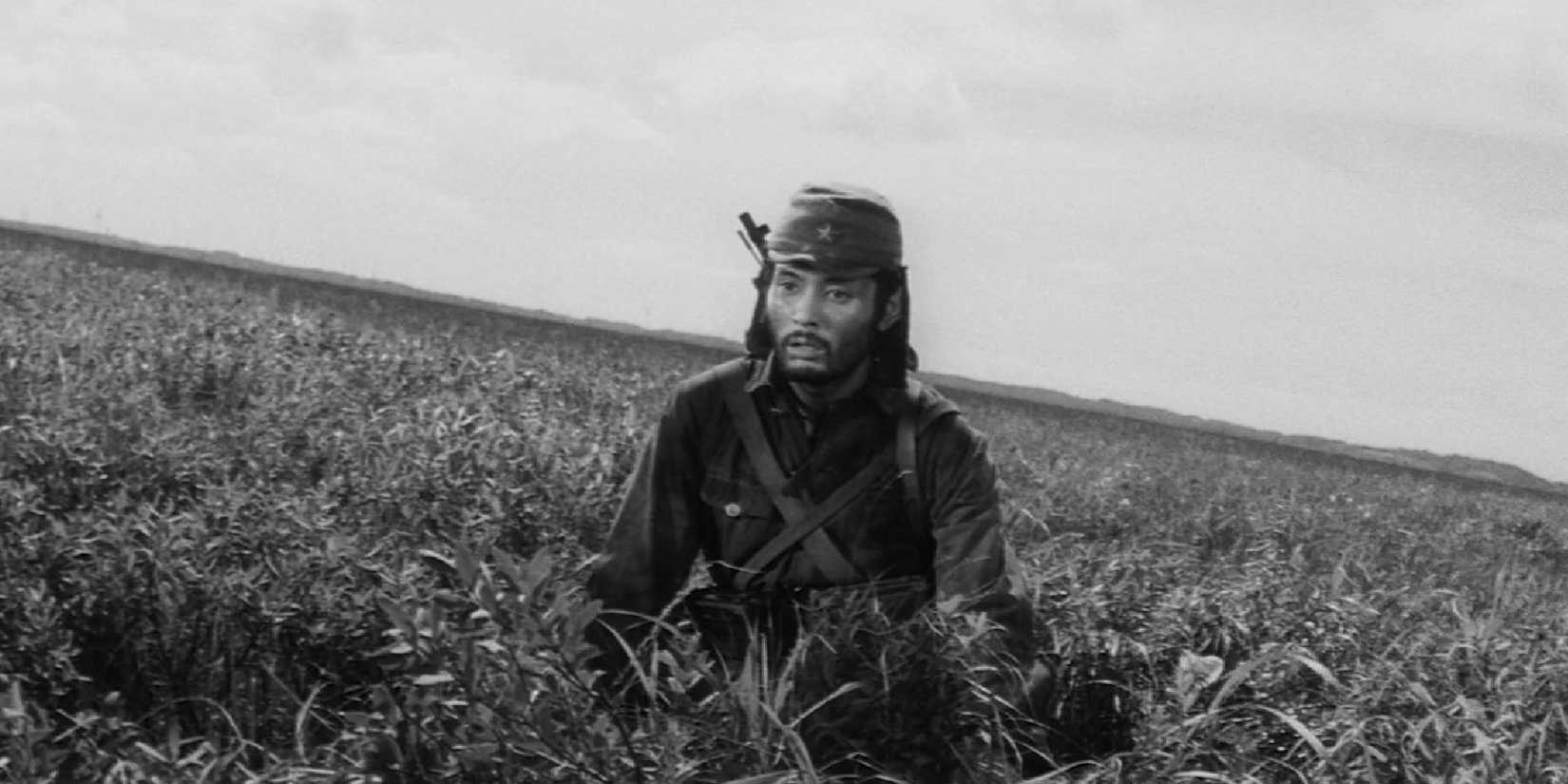 A soldier on a field looking vacant in The Human Condition III: A Soldier’s Prayer