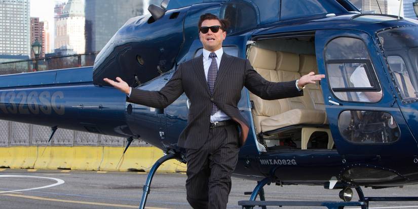 Jordan Belfort (Leonardo DiCaprio) boastfully leaving a helicopter in The Wolf of Wall Street