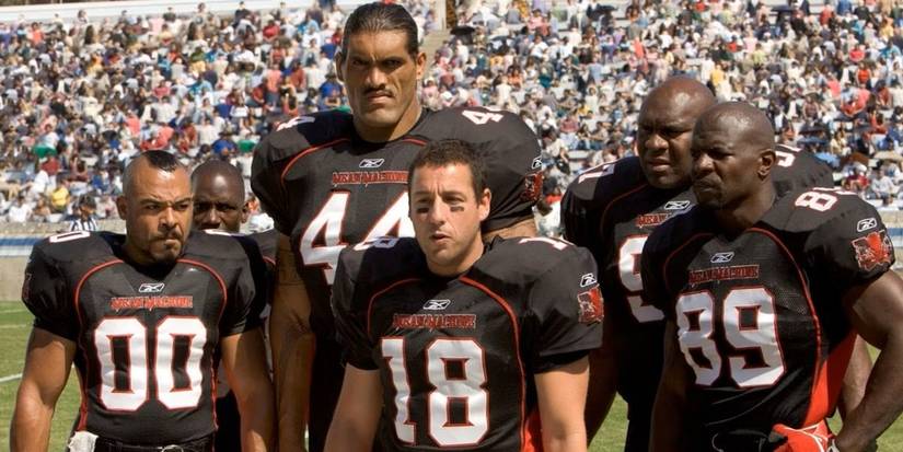 The prison team is suited up in their red and black uniforms in The Longest Yard.