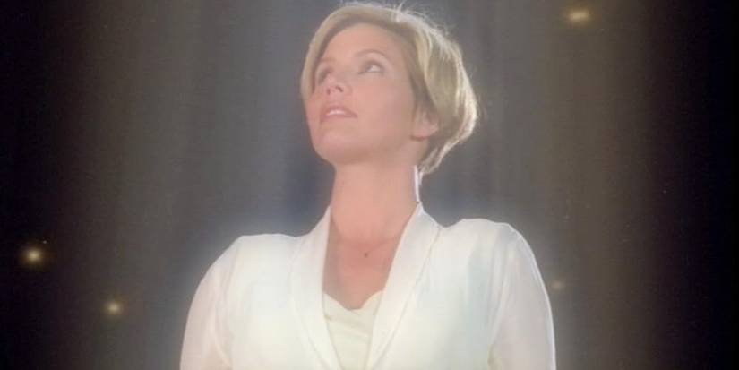 Charisma Carpenter as Cordelia ascending in a white shirt in Angel